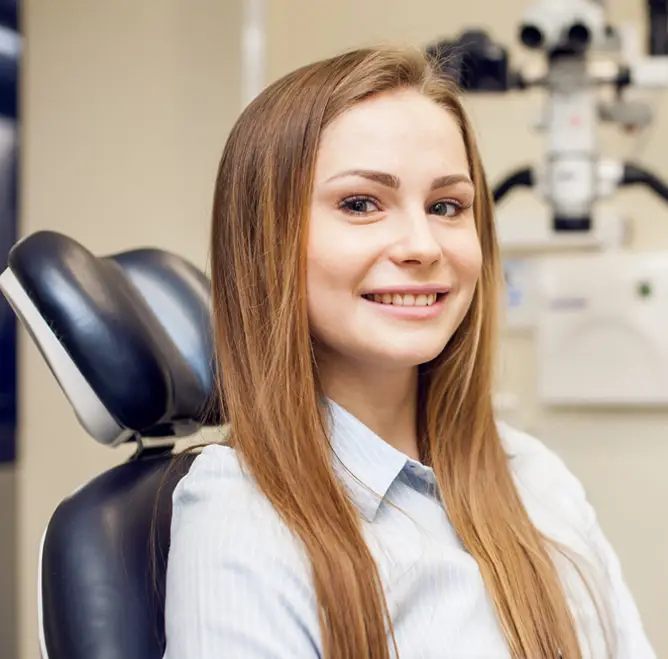 Dental assistant smiling in a clinic